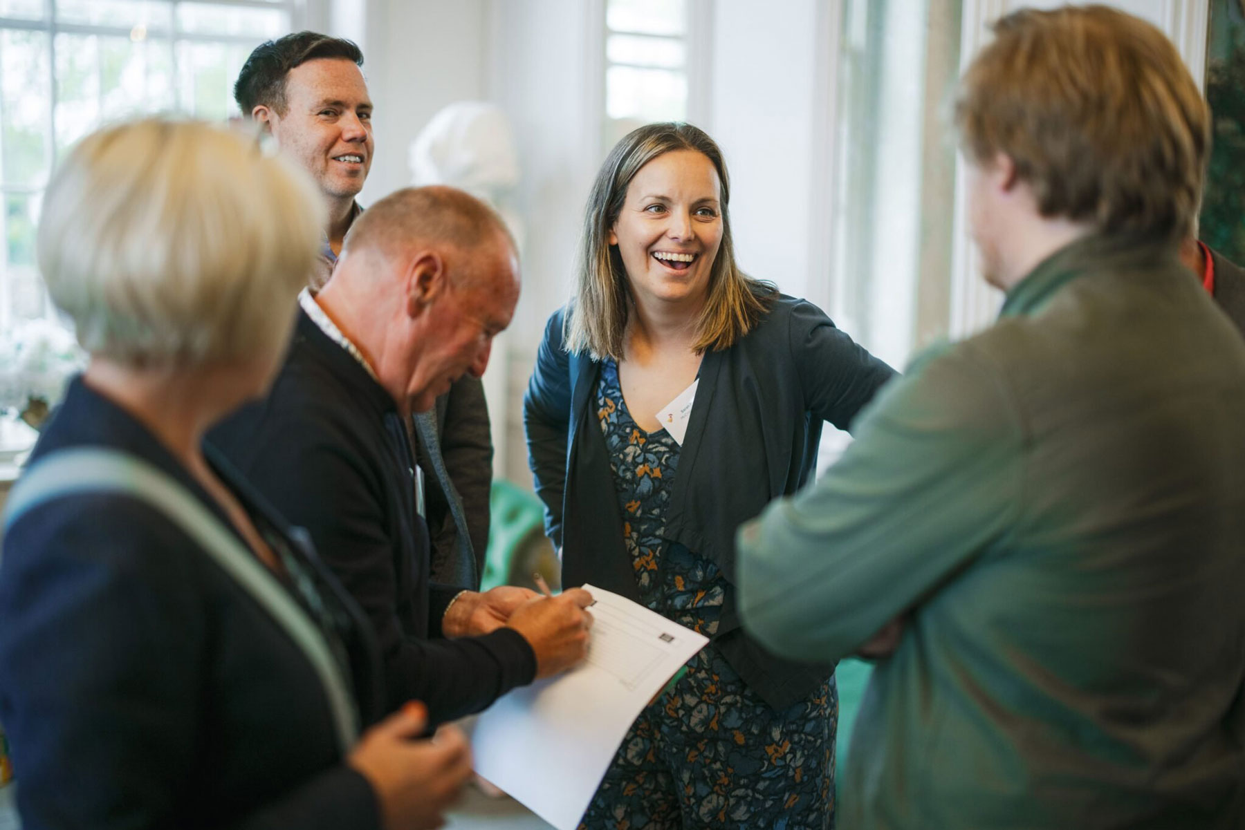 Colleagues laughing together
